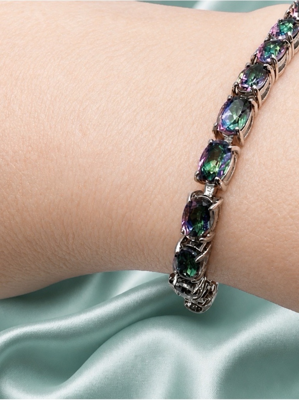 High end mystic quartz tennis bracelet set in rhodium over 925 Sterling Silver.
